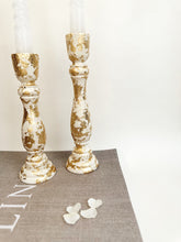 Load image into Gallery viewer, Two Ivory Candlesticks With Gold Leaf Detail
