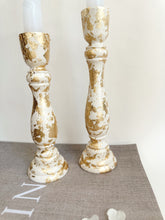 Load image into Gallery viewer, Two Ivory Candlesticks With Gold Leaf Detail
