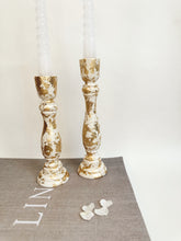 Load image into Gallery viewer, Two Ivory Candlesticks With Gold Leaf Detail
